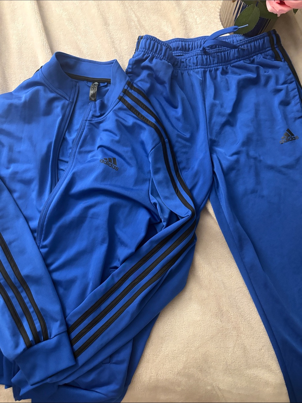 adidas Royal Blue Tracksuit with Black Stripes 
Perfect for men or women